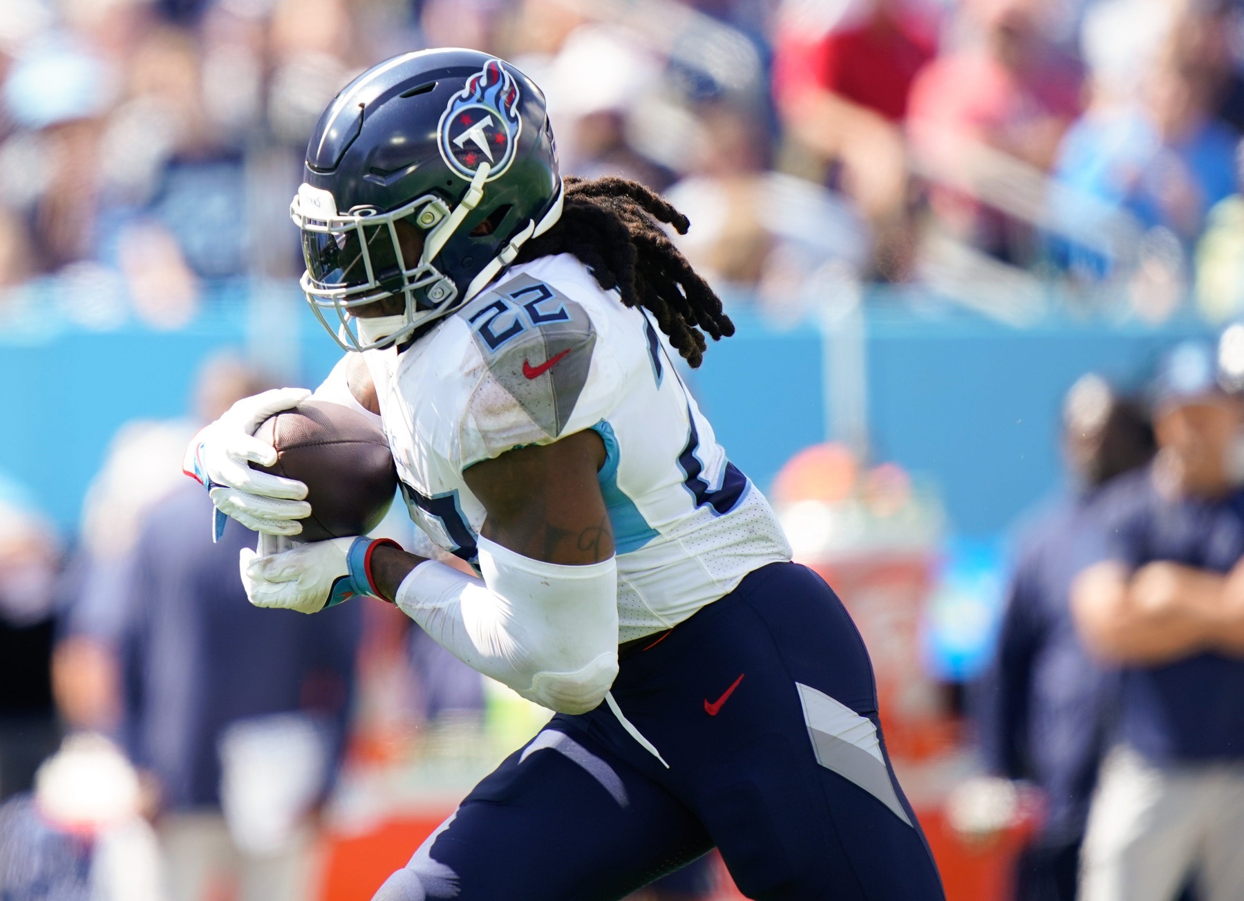 Derrick Henry (22) runs the ball in the third quarter against the Los Angeles Chargers at Nissan Stadium.