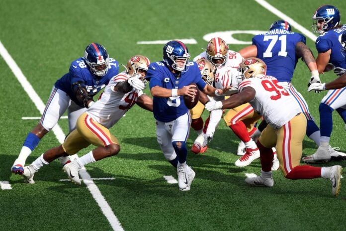 New York Giants quarterback Daniel Jones (8) scrambles with pressure from the San Francisco 49er defense in the second half. The Giants lose to the 49ers, 36-9, in an NFL game at MetLife Stadium on Sunday, Sept. 27, 2020, in East Rutherford.