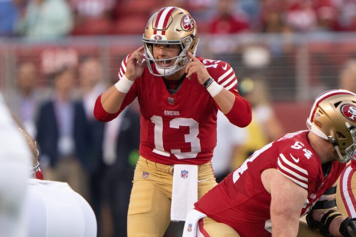 San Francisco 49ers quarterback Brock Purdy (13) signals during the first quarter against the Los Angeles Chargers at Levi's Stadium.