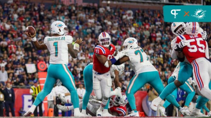 The Miami Dolphins offensive line blocks for QB Tua Tagovailoa (1) against the New England Patriots.