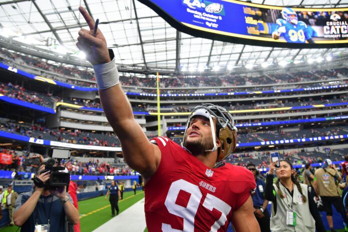 San Francisco 49ers defensive end Nick Bosa (97) celebrates a victory against the Los Angeles Rams.