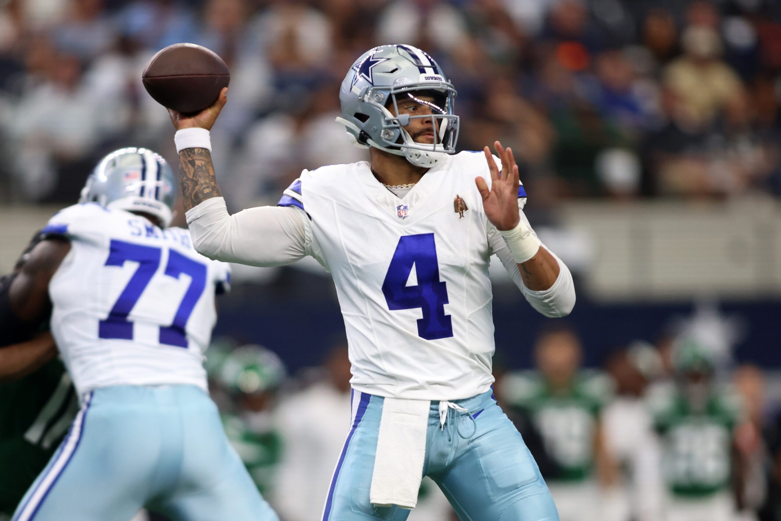 Dak Prescott (4) throws a pass in the first quarter against the New York Jets at AT&T Stadium.