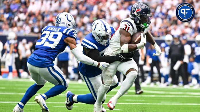 Indianapolis Colts defensive end Kwity Paye (51) tackles Houston Texans running back Dameon Pierce (31) during the second half at NRG Stadium.