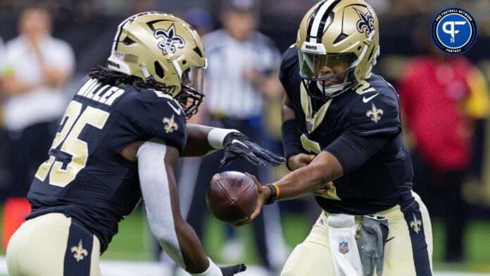 New Orleans Saints quarterback Jameis Winston (2) hands the ball off to running back Kendre Miller (25) against the Houston Texans during the first half at the Caesars Superdome.