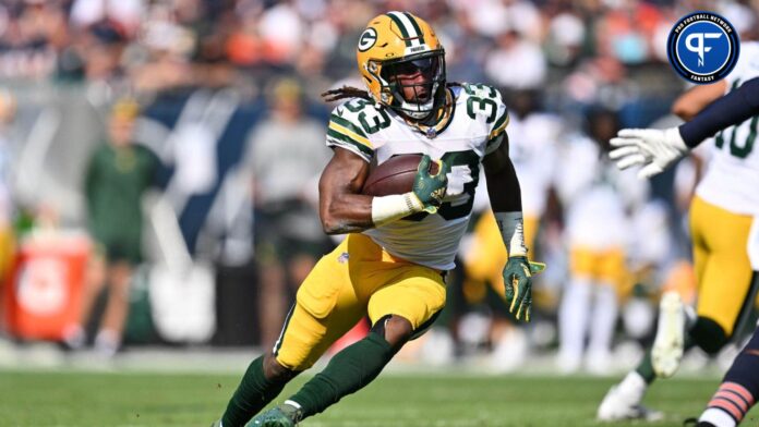 Aaron Jones (33) runs with the ball against the Chicago Bears at Soldier Field.