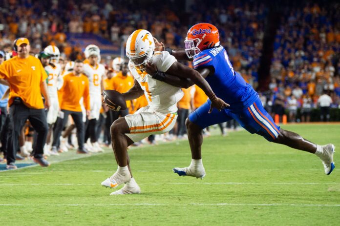 Florida defensive end Princely Umanmielen (1) tackles Tennessee quarterback Joe Milton III (7) on a failed two-point conversion play during a football game between Tennessee and Florida at Ben Hill Griffin Stadium in Gainesville, Fla., on Saturday, Sept. 16, 2023.
