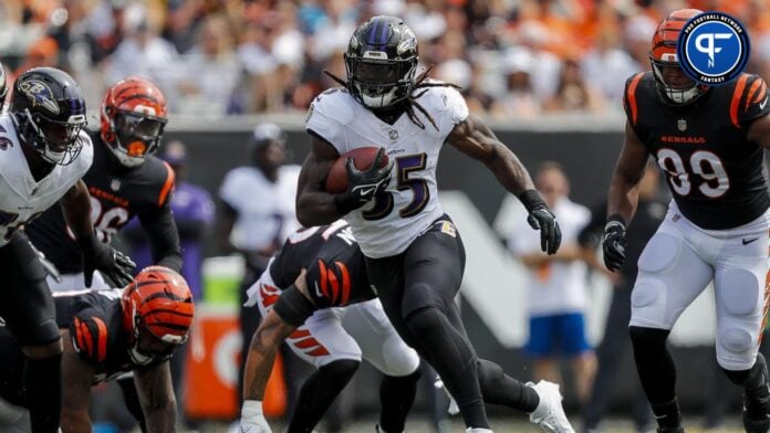 Gus Edwards (35) runs with the ball against the Cincinnati Bengals in the first half at Paycor Stadium.