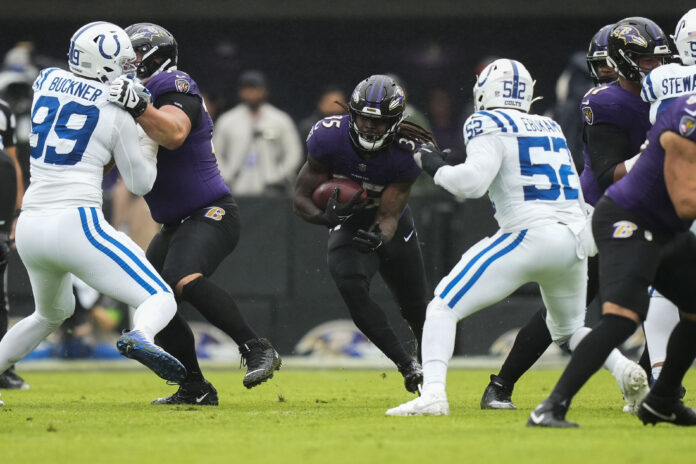 Baltimore Ravens RB Gus Edwards (35) runs the ball against the Indianapolis Colts.