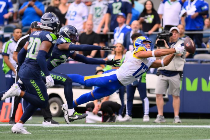 Los Angeles Rams wide receiver Puka Nacua lays out to catch pass against the Seattle Seahawks.