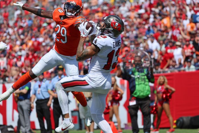 Tampa Bay Buccaneers wide receiver Mike Evans (13) catches a touchdown over Chicago Bears cornerback Tyrique Stevenson (29) during the second half at Raymond James Stadium.