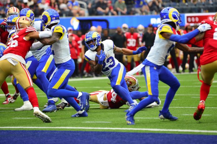 Los Angeles Rams running back Kyren Williams (23) runs the ball for a touchdown against the San Francisco 49ers during the first half at SoFi Stadium.