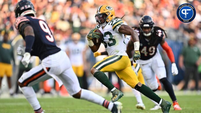 Aaron Jones (33) races to the end zone on a 35-yard touchdown catch in the second half against the Chicago Bears at Soldier Field.