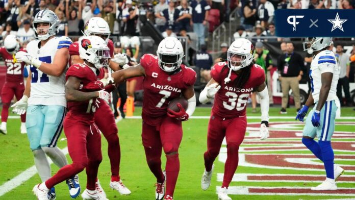 Arizona Cardinals linebacker Kyzir White (7) intercepts a Dallas Cowboys pass in the end zone in the second half at State Farm Stadium in Glendale on Set. 24, 2023.