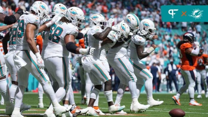 The Miami Dolphins offense does a dance as a TD celebration.