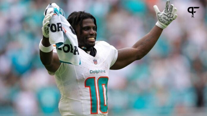 Miami Dolphins WR Tyreek Hill (10) celebrates from the sidelines.