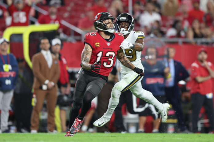 New Orleans Saints cornerback Paulson Adebo (29) is called for pass interference on Tampa Bay Buccaneers wide receiver Mike Evans (13) in the fourth quarter at Raymond James Stadium.
