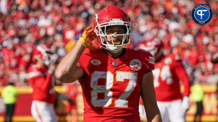 Travis Kelce (87) motions to the fans agains the Chicago Bears during the first half at GEHA Field at Arrowhead Stadium.