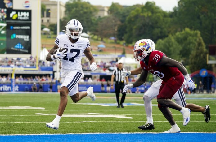 Brigham Young Cougars wide receiver Keelan Marion scores against the Kansas Jayhawks.