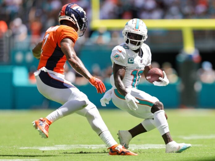 Miami Dolphins WR Tyreek Hill runs with the football.