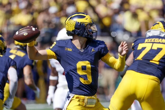J.J. McCarthy (9) throws the ball against the Rutgers Scarlet Knights in the second half at Michigan Stadium.