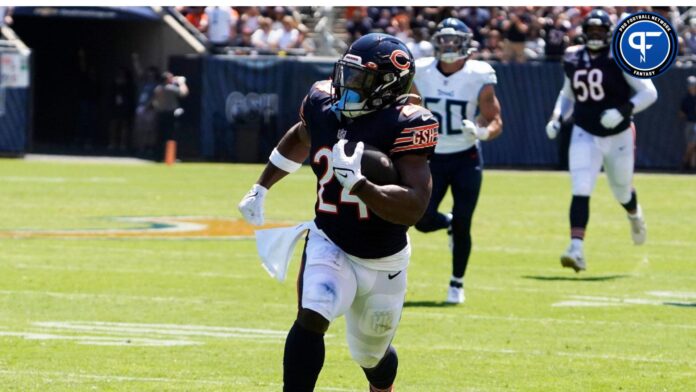 Aug 12, 2023; Chicago, Illinois, USA; Chicago Bears running back Khalil Herbert (24) catches a pass and runs for a touchdown against the Tennessee Titans during the first quarter at Soldier Field.