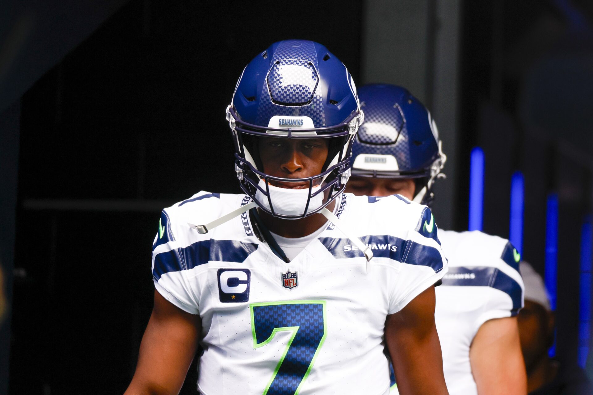 Seattle Seahawks QB Geno Smith leads his team to the field.