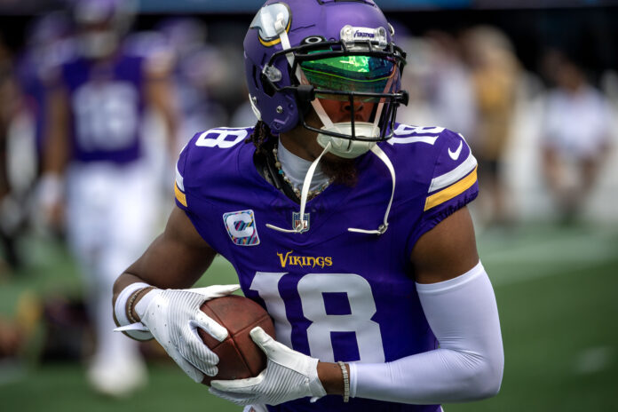 Minnesota Vikings WR Justin Jefferson (18) warms up before a game.