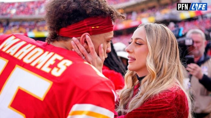 Patrick Mahomes (15) kisses Brittany Matthews before the AFC Championship Game against the Cincinnati Bengals at GEHA Field at Arrowhead Stadium.