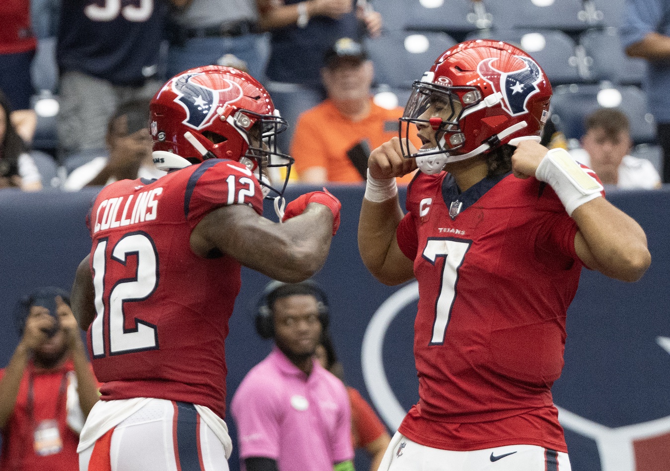 Nico Collins (12) celebrates his touchdown with quarterback C.J. Stroud (7) against the Pittsburgh Steelers in the second half at NRG Stadium.