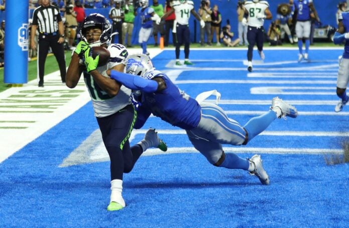 Tyler Lockett (16) catches a touchdown against Detroit Lions cornerback Jerry Jacobs (23) during the second half at Ford Field.