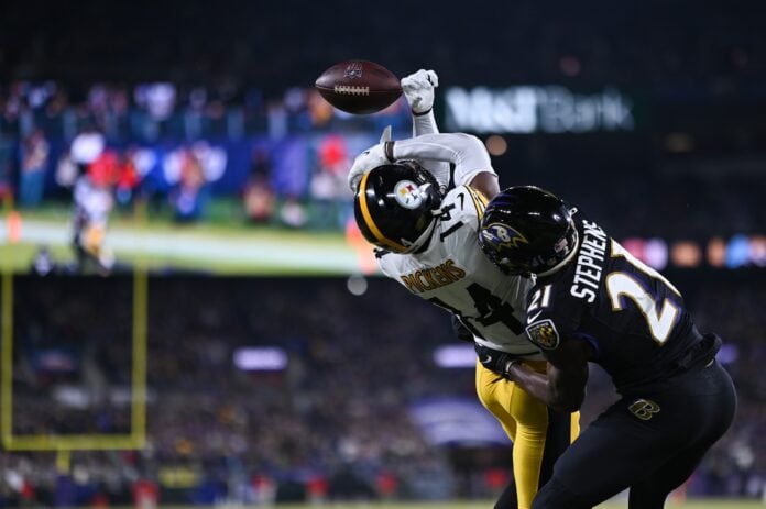 Baltimore Ravens cornerback Brandon Stephens (21) breaks up a pass intended for Pittsburgh Steelers wide receiver George Pickens (14).