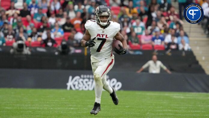 Bijan Robinson (7) carries the ball against the Jacksonville Jaguars in the second half during an NFL International Series game at Wembley Stadium.