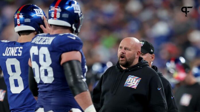 New York Giants head coach Brian Daboll talks to quarterback Daniel Jones (8) as he comes off the field during the second quarter against the Seattle Seahawks at MetLife Stadium.
