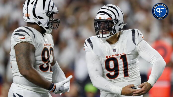 Cincinnati Bengals defensive end Trey Hendrickson (91) reacts after a play with defensive tackle BJ Hill (92) in the second half against the Los Angeles Rams at Paycor Stadium.