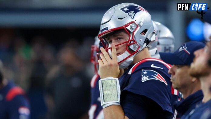 AFC quarterback Mac Jones of the New England Patriots (10) looks for a  receiver versus the NFC …