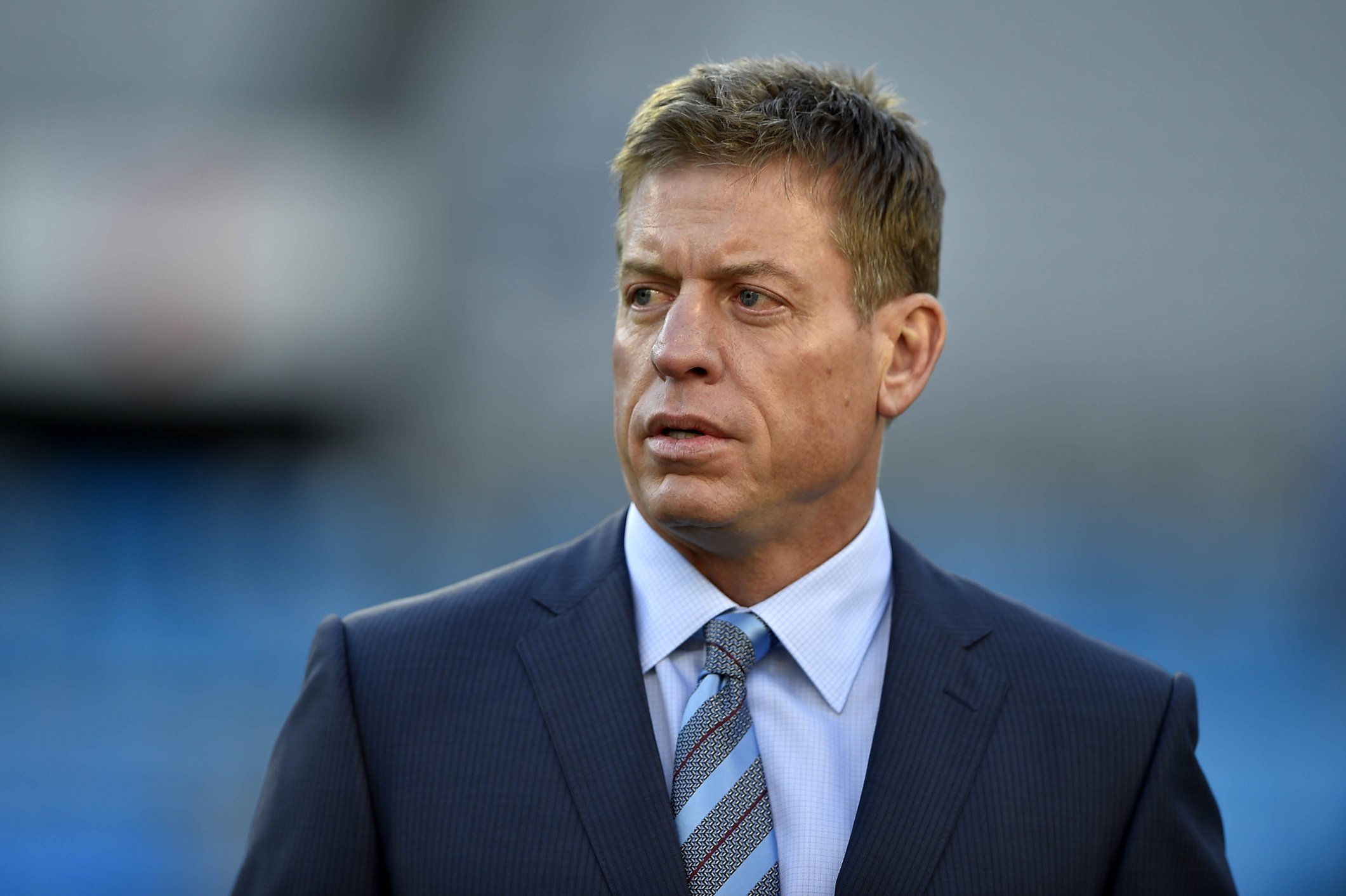 Fox Sports analyst Troy Aikman on the field before the game between the Carolina Panthers and the Arizona Cardinals in the NFC Championship football game at Bank of America Stadium.