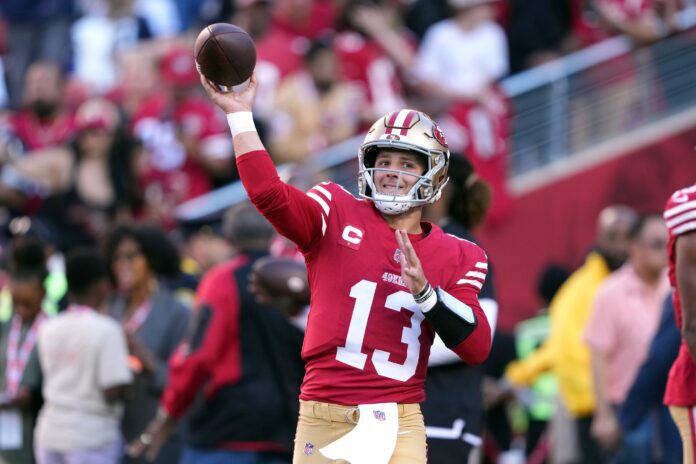 San Francisco 49ers quarterback Brock Purdy warms up before the