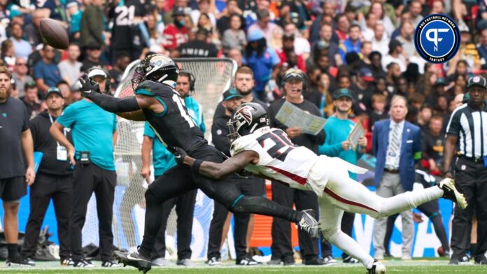 Jacksonville Jaguars wide receiver Christian Kirk (13) catches the ball under pressure from Atlanta Falcons cornerback Dee Alford (20) during the first half of an NFL International Series game.