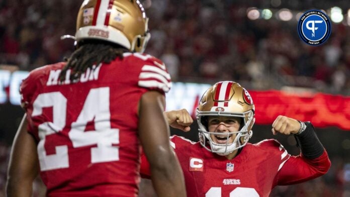 San Francisco 49ers quarterback Brock Purdy (13) celebrates with running back Jordan Mason (24) after a touchdown against the Dallas Cowboys.