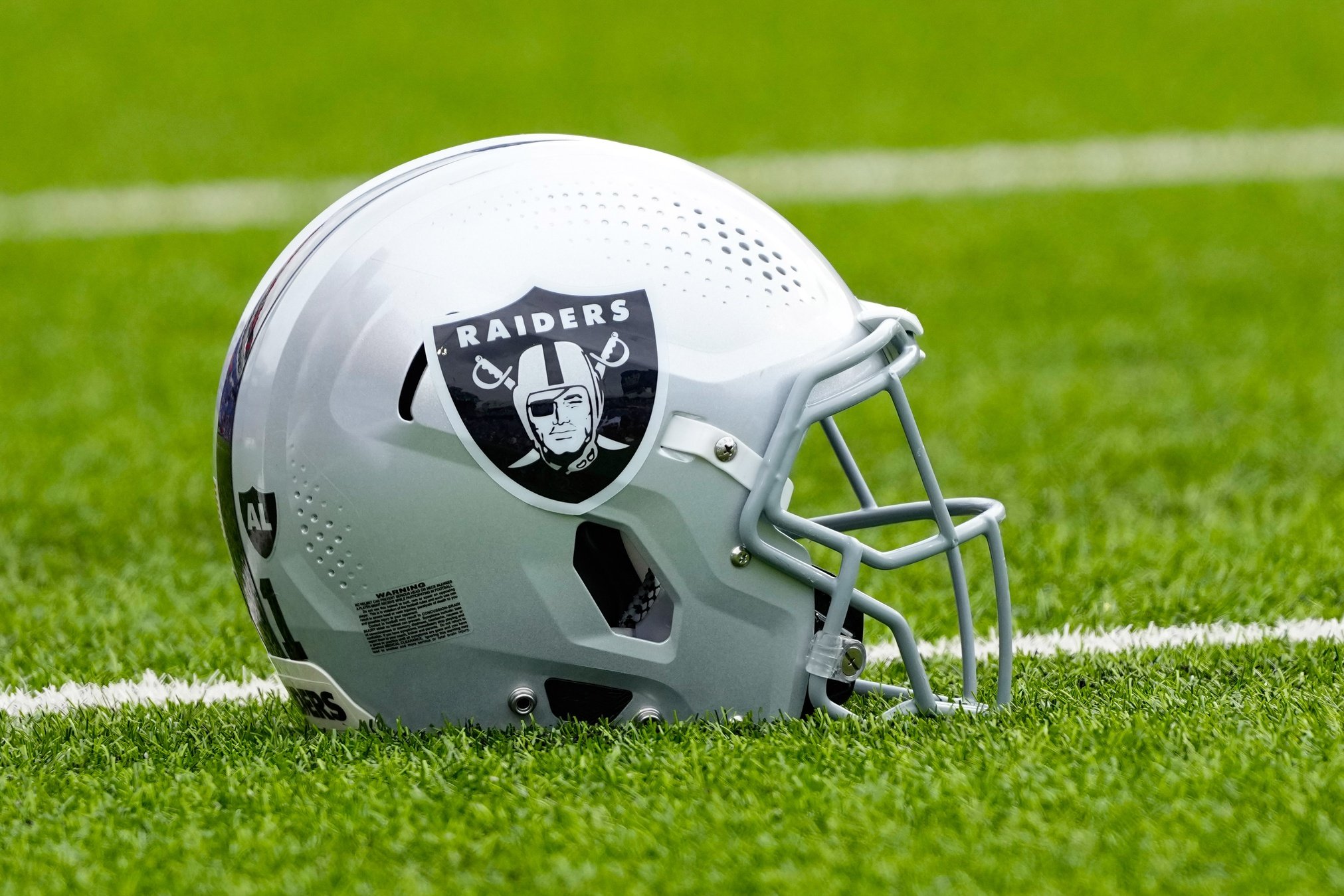 A Las Vegas Raiders helmet on the field prior to the game against the Buffalo Bills at Highmark Stadium.