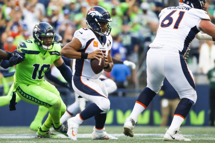 Denver Broncos QB Russell Wilson (3) runs the ball against the Seattle Seahawks.