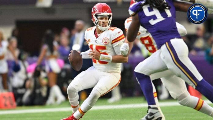 Kansas City Chiefs quarterback Patrick Mahomes (15) scrambles against the Minnesota Vikings.
