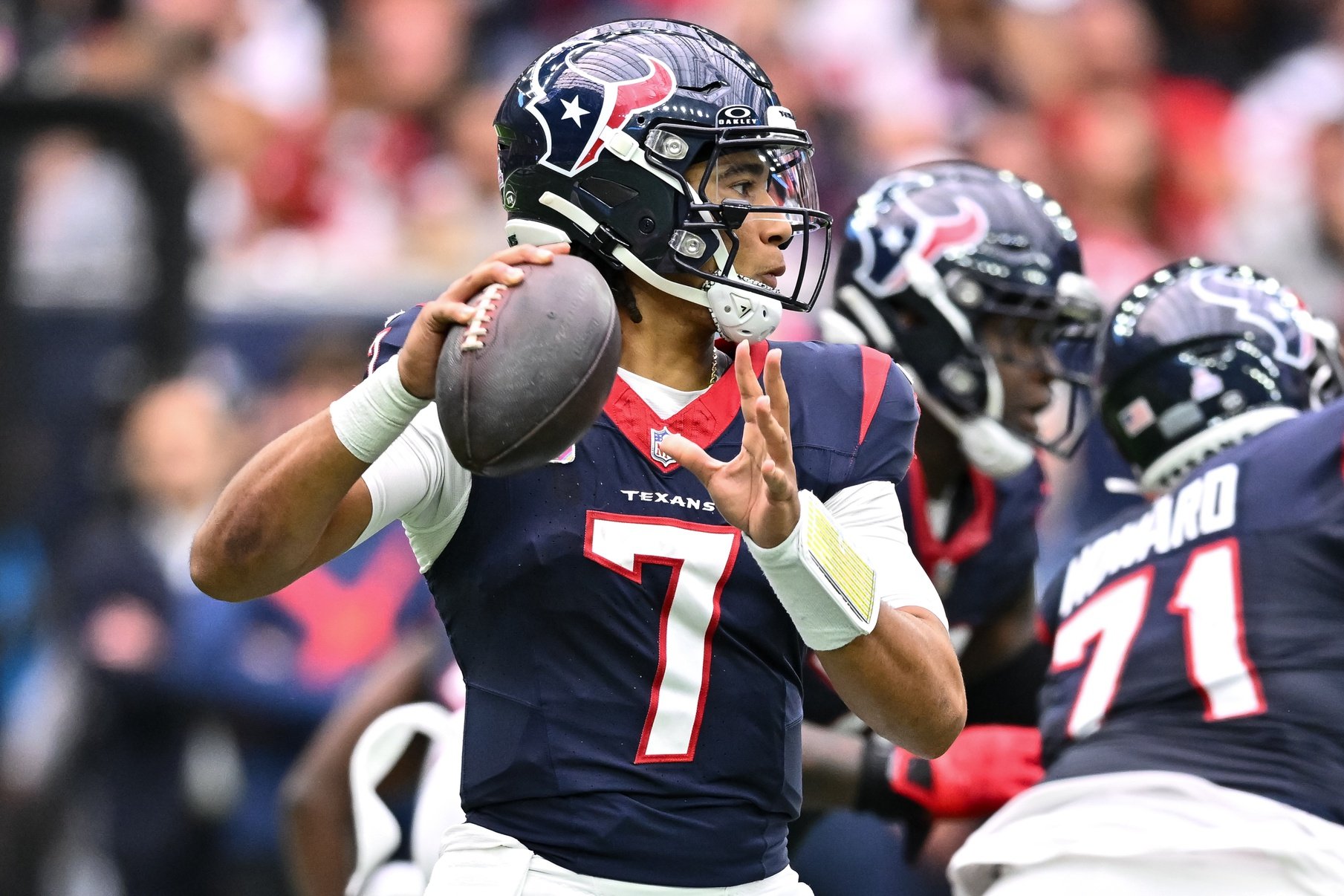 C.J. Stroud (7) passes the ball during the third quarter against the New Orleans Saints at NRG Stadium.