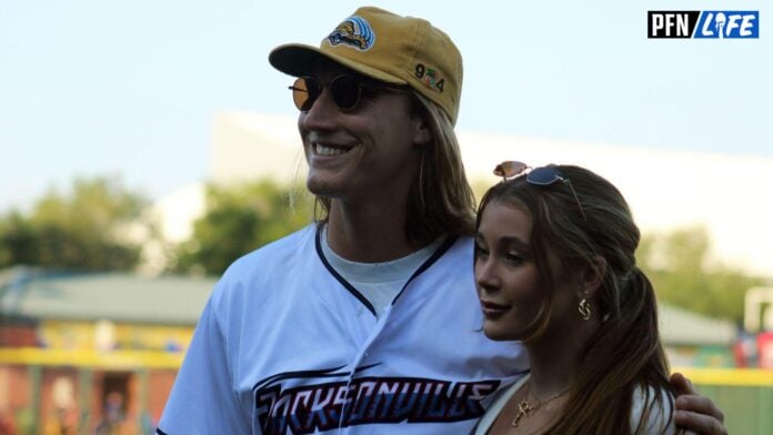 Jaguars quarterback Trevor Lawrence and his wife, Marissa, pose for fans after his ceremonial first pitch before the Jacksonville Jumbo Shrimp's Triple-A baseball home opener against Durham on April 4, 2023.
