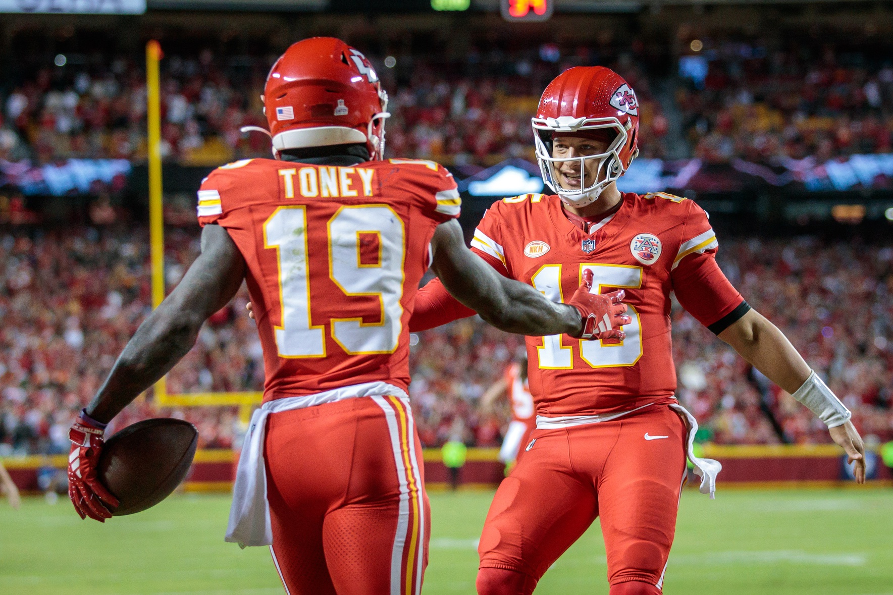 Patrick Mahomes (15) and Kansas City Chiefs wide receiver Kadarius Toney (19) celebrate after a touch down during the second quarter against the Denver Broncos at GEHA Field at Arrowhead Stadium.