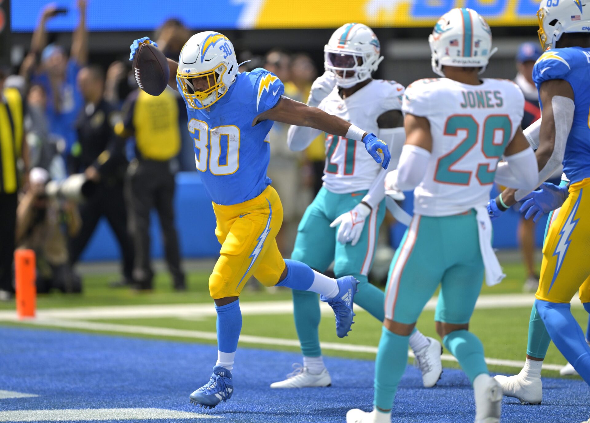 Austin Ekeler (30) celebrates after a touchdown in the first half against the Miami Dolphins at SoFi Stadium.