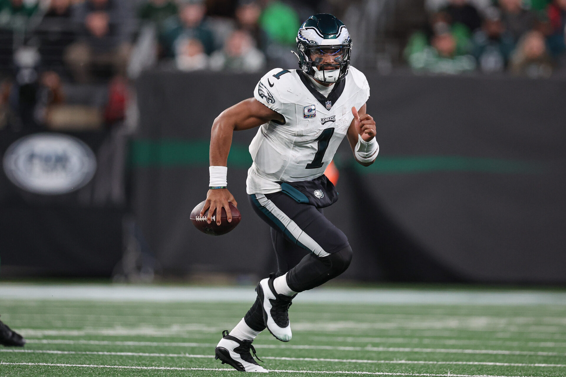 Philadelphia Eagles quarterback Jalen Hurts (1) carries the ball during the second half against the New York Jets at MetLife Stadium.