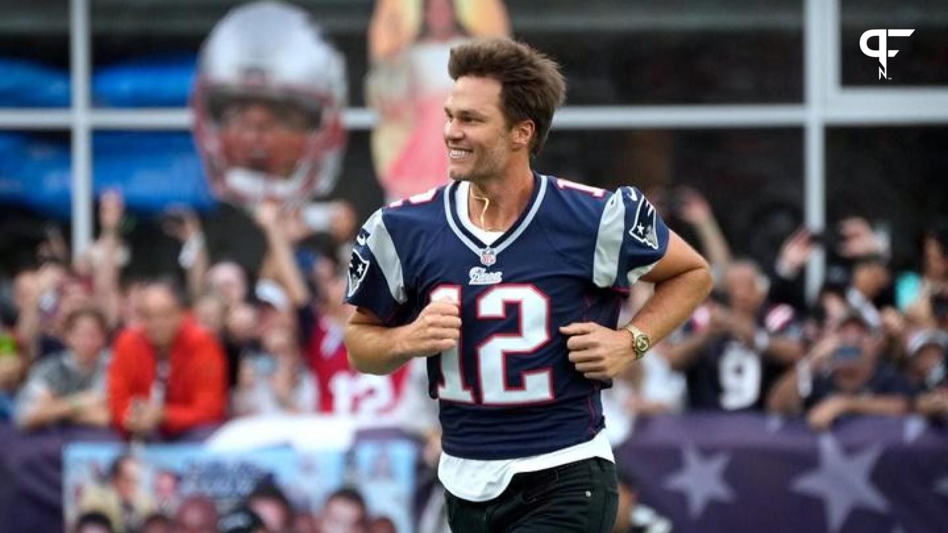 Former QB Tom Brady runs onto the field at Gillette Stadium before the team inducts him into the Patriots Hall of Fame.