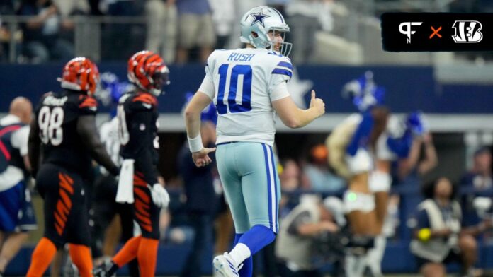 Dallas Cowboys quarterback Cooper Rush (10) looks toward the Cincinnati Bengals sideline after throwing a touchdown pass to Dallas Cowboys running back Tony Pollard (20) in the first quarter of an NFL Week 2 game against the Cincinnati Bengals, Sunday, Sept. 18, 2022, at AT&T Stadium in Arlington, Texas.