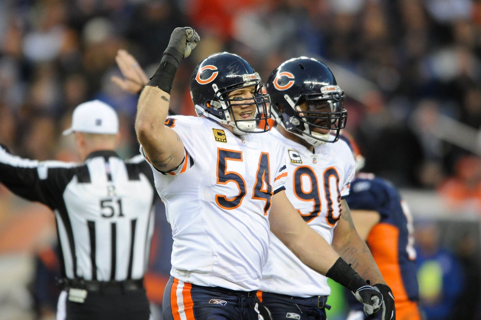 Brian Urlacher (54) reacts after the bears forced a turnover during the fourth quarter of the game against the Denver Broncos at Sports Authority Field.